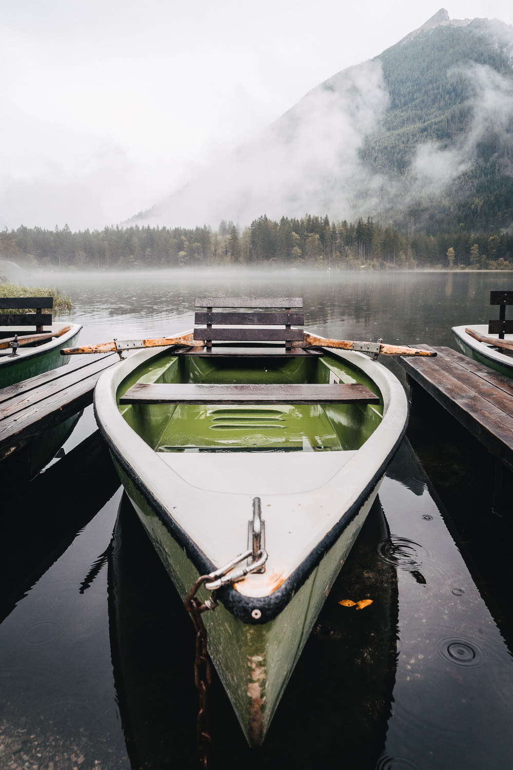 a row boat sitting on top of a body of water