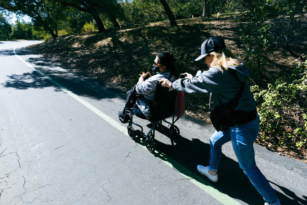 a woman pushing a child in a stroller