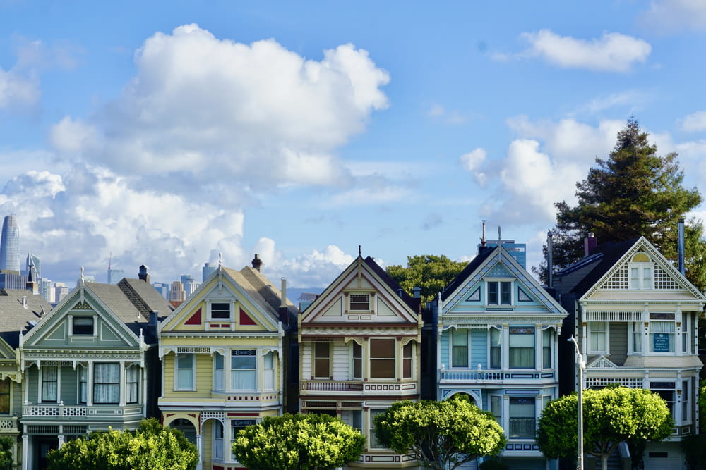 a row of painted houses in a neighborhood