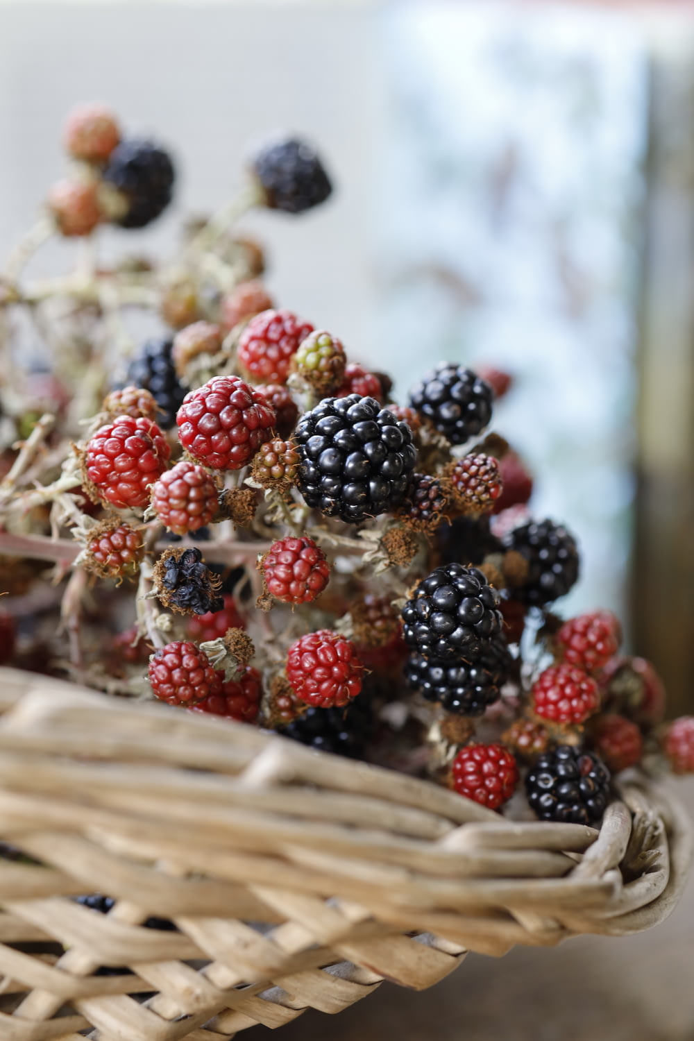a basket filled with berries sitting on top of a table