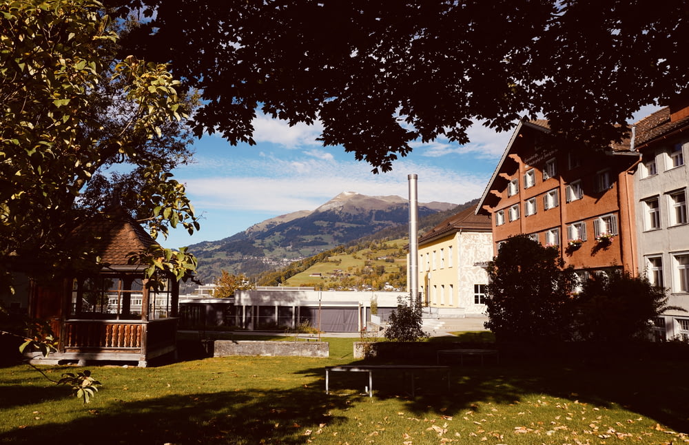 a view of a building with mountains in the background