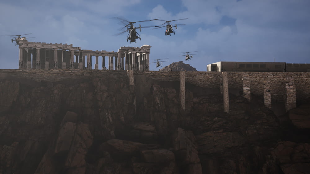 a group of military helicopters flying over a cliff