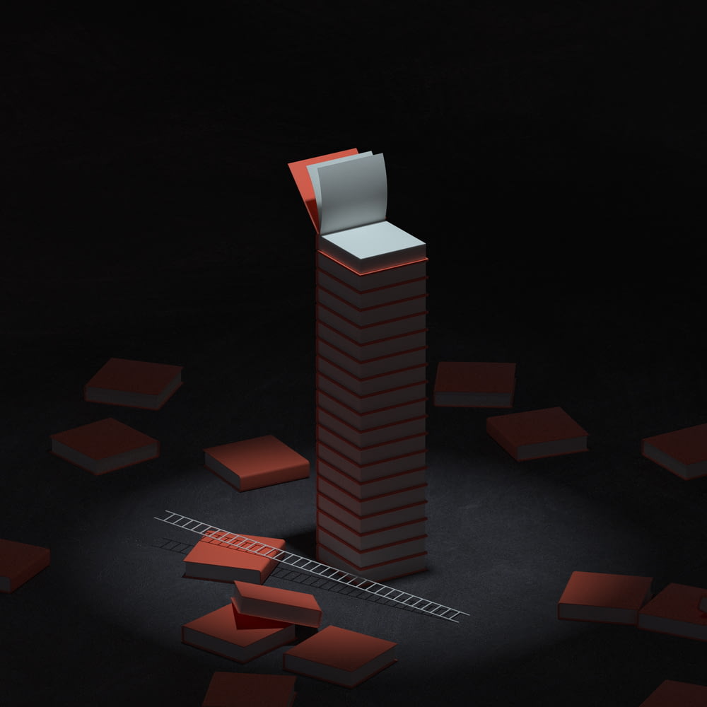 a red and white box sitting on top of a tall tower