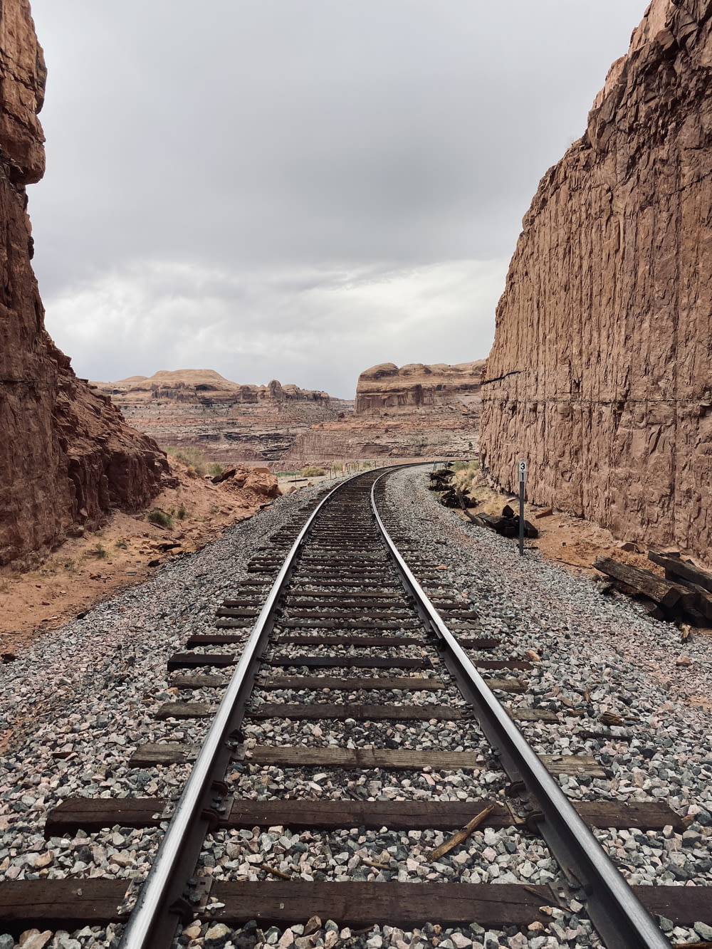 a train track in the middle of a desert