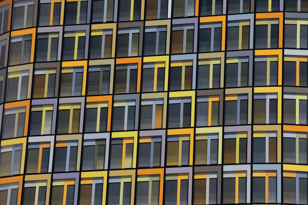 a multicolored building with many windows