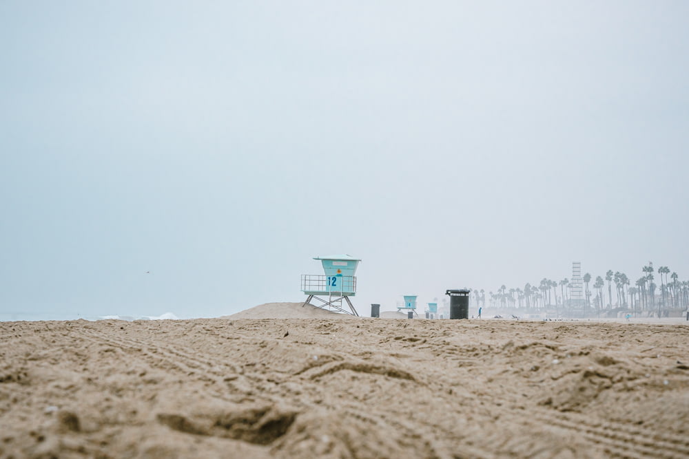 a beach with a lifeguard tower on top of it