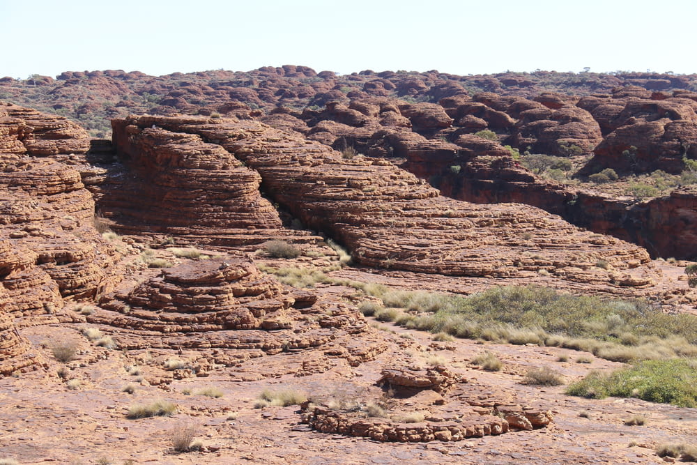 a group of rocks in the middle of a desert