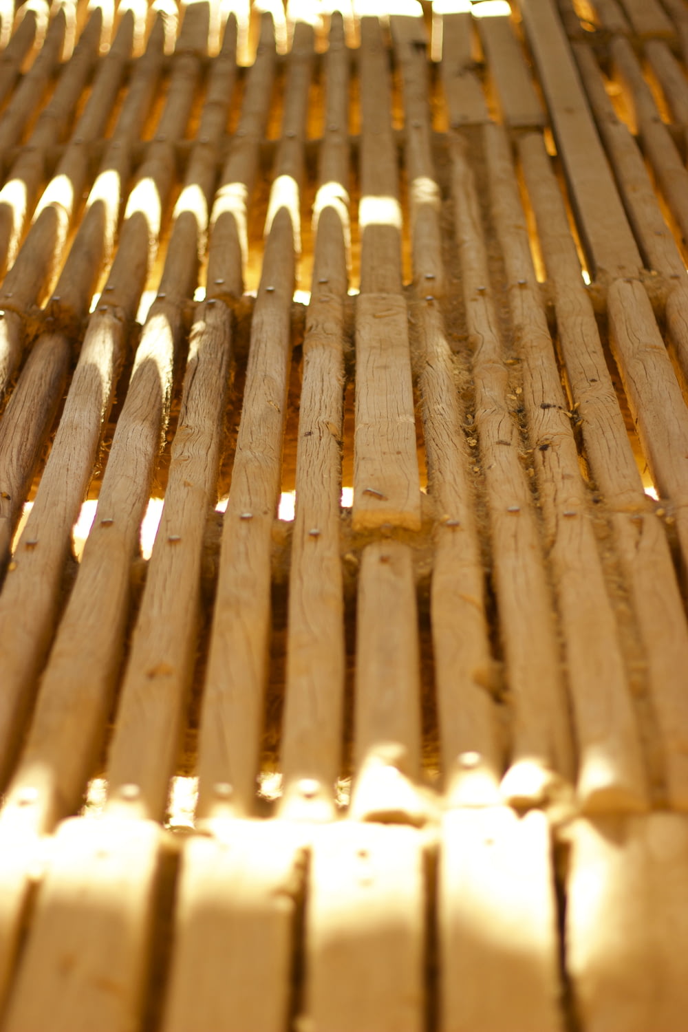a close up of a wooden bench made out of boards