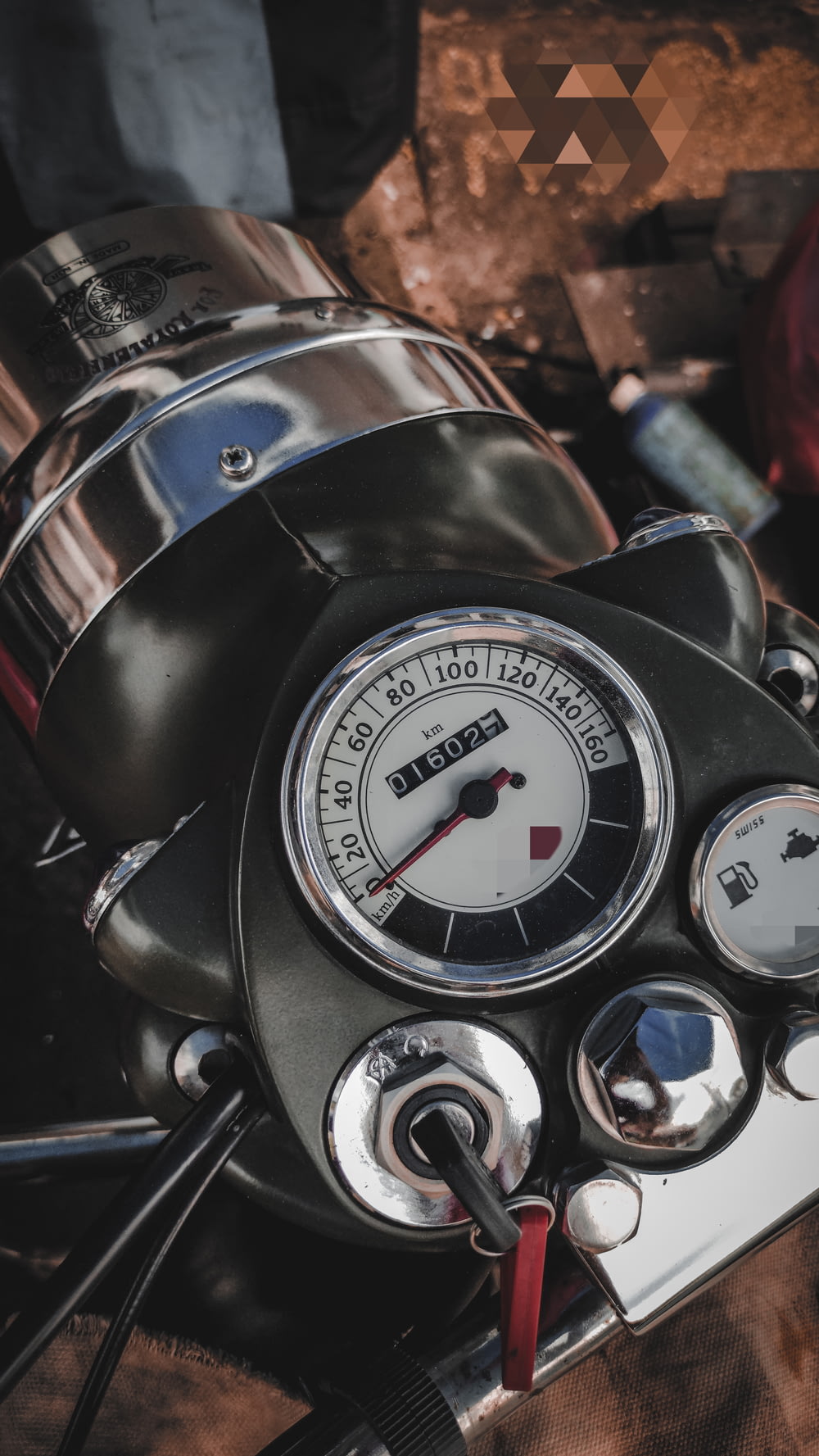 a close up of a speedometer on a motorcycle