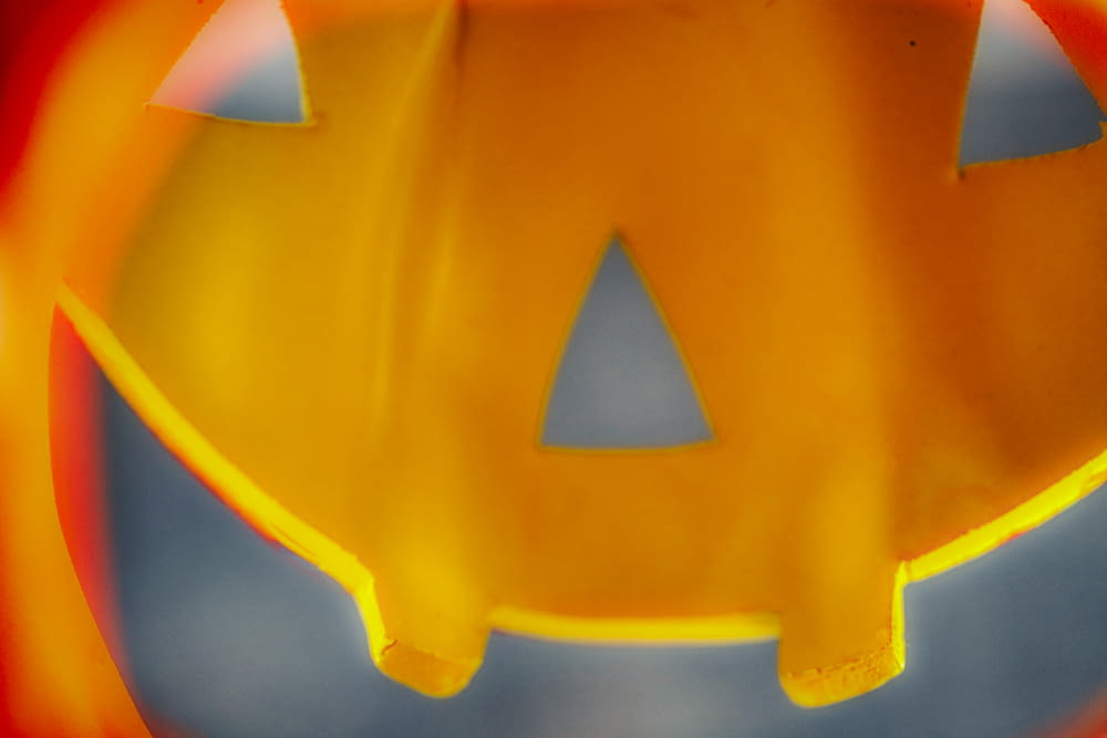 a close up of a plastic pumpkin shaped object
