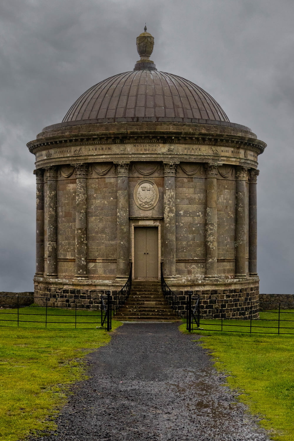 a stone building with a dome on top of it