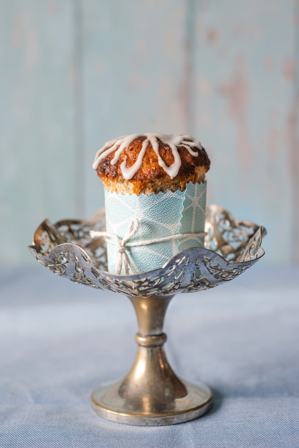 a cupcake sitting on top of a metal stand