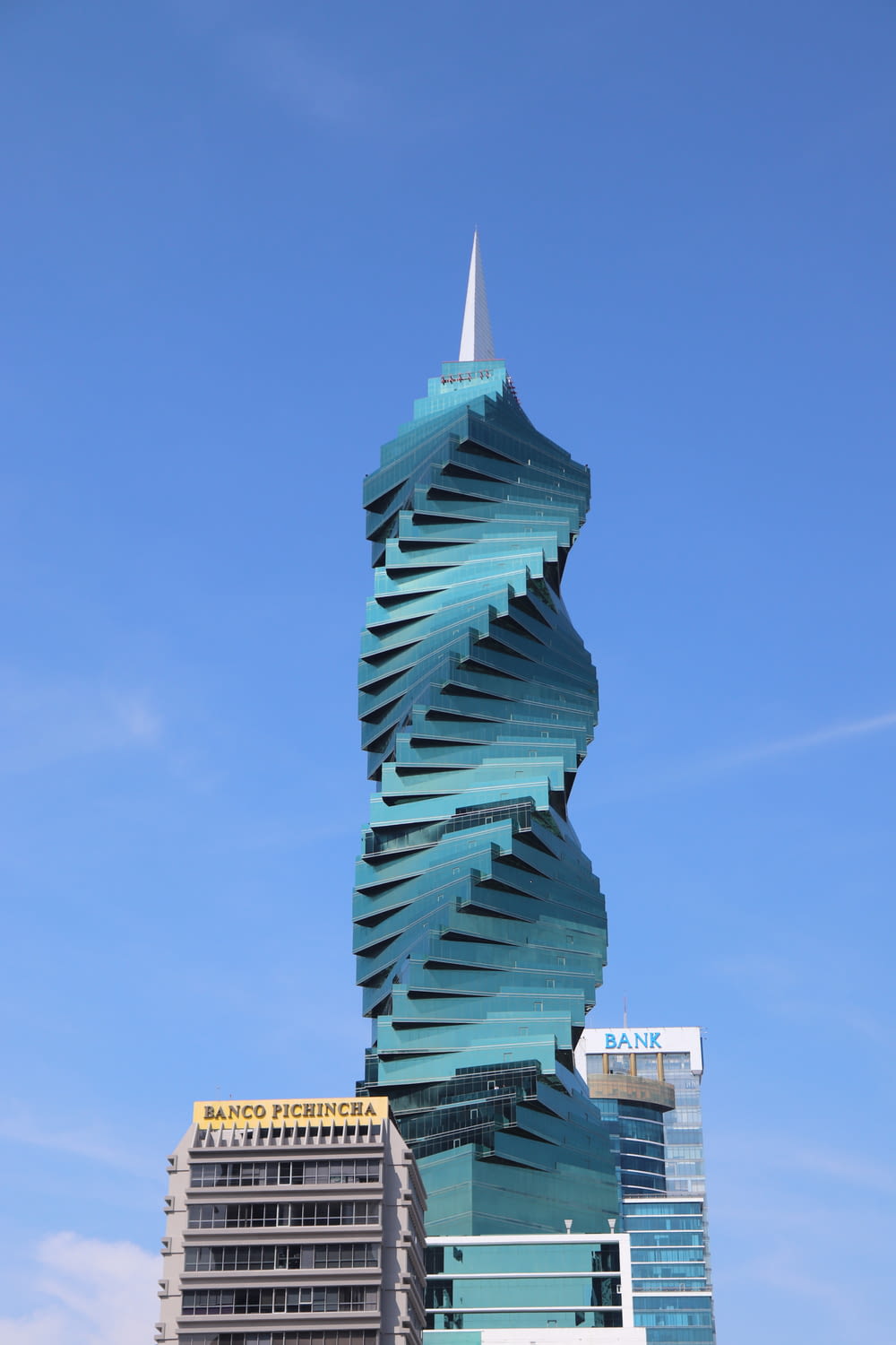 a tall building with a spiral design on top of it