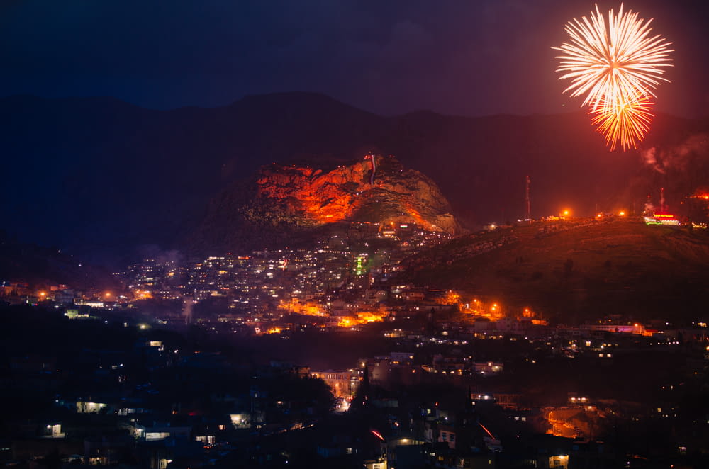 a view of a city at night with fireworks