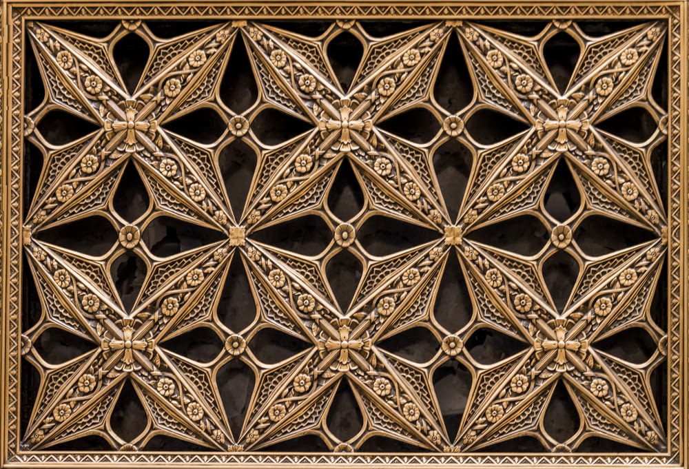 a close up of a decorative design on a wall