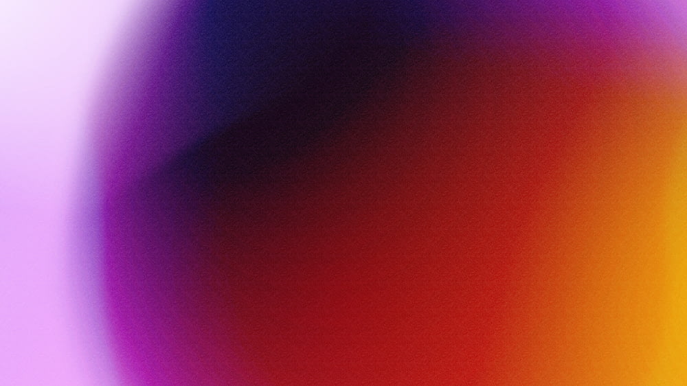 a blurry image of a purple and red background