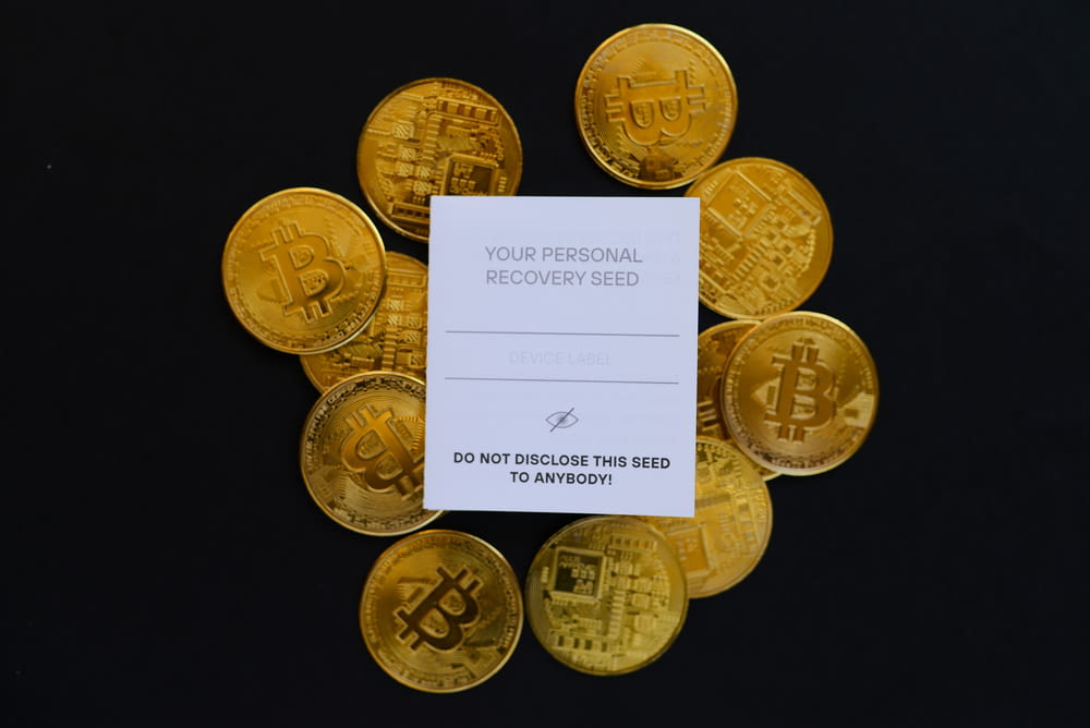 a pile of gold bitcoins sitting on top of a table