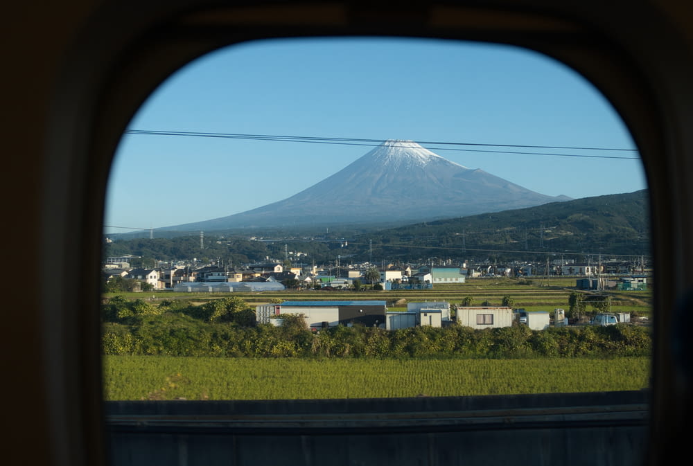 a view of a mountain from a train window