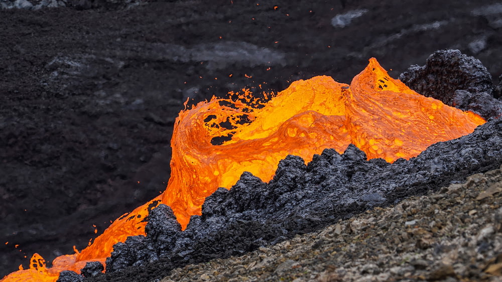 a close up of a mountain with lava coming out of it