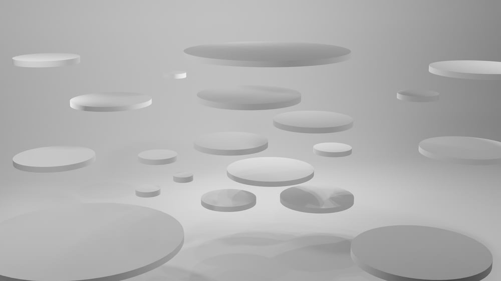 a group of white circles floating in the air
