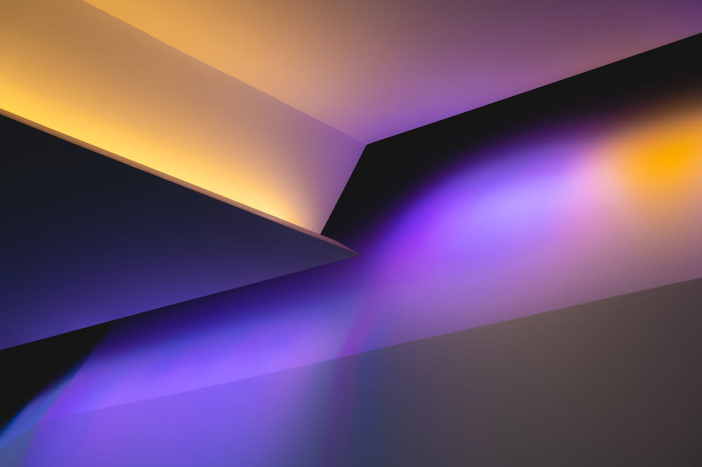 an abstract image of a purple and yellow light
