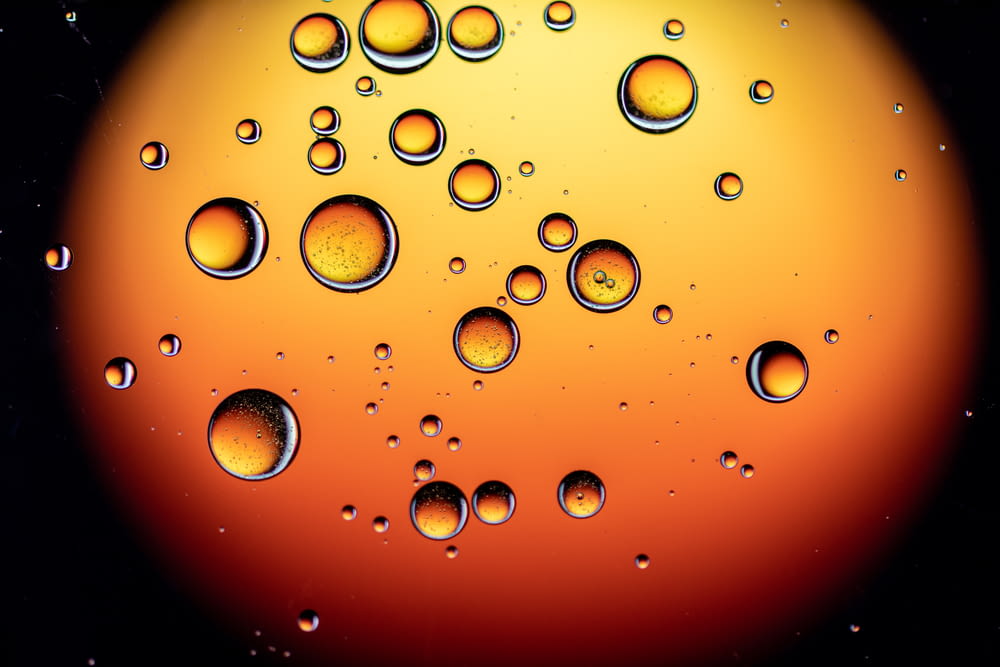a close up of water bubbles on a black background