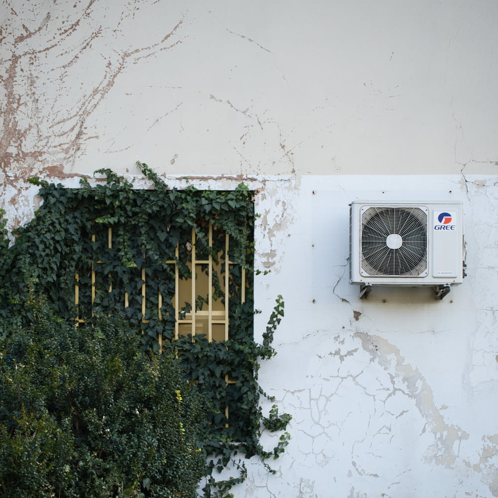 a air conditioner mounted to the side of a building