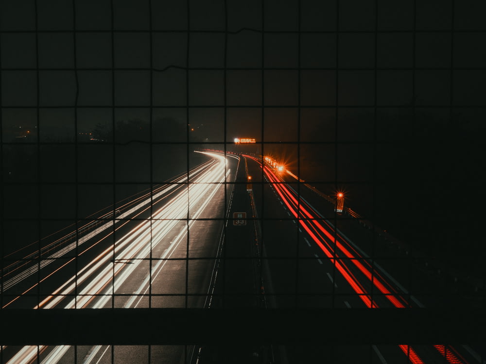 a view of a highway at night from a bridge