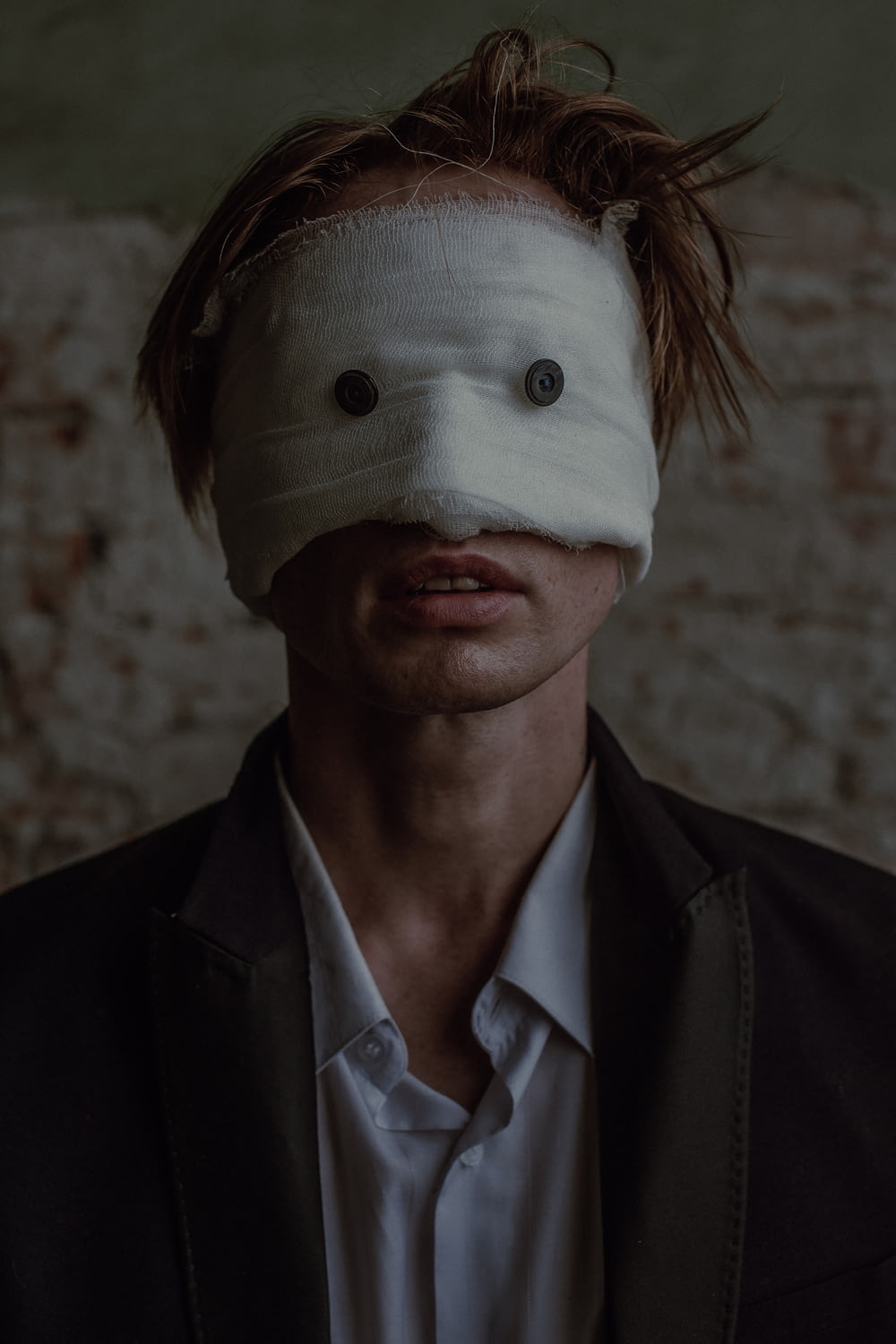 a man with a blindfold over his face