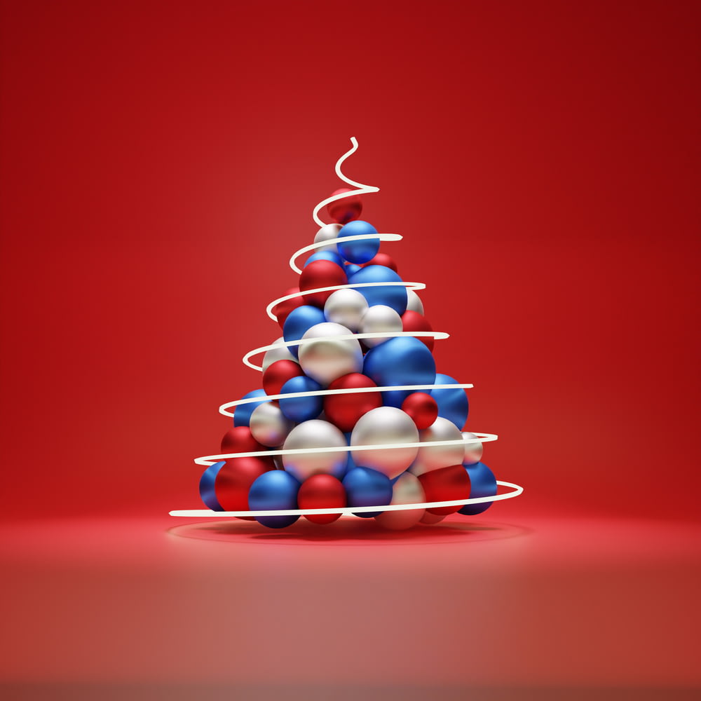 a red white and blue christmas tree on a red background