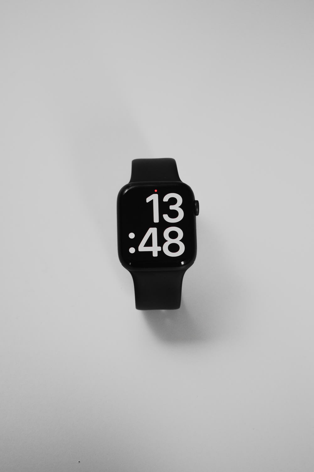 a black watch with white numbers on it