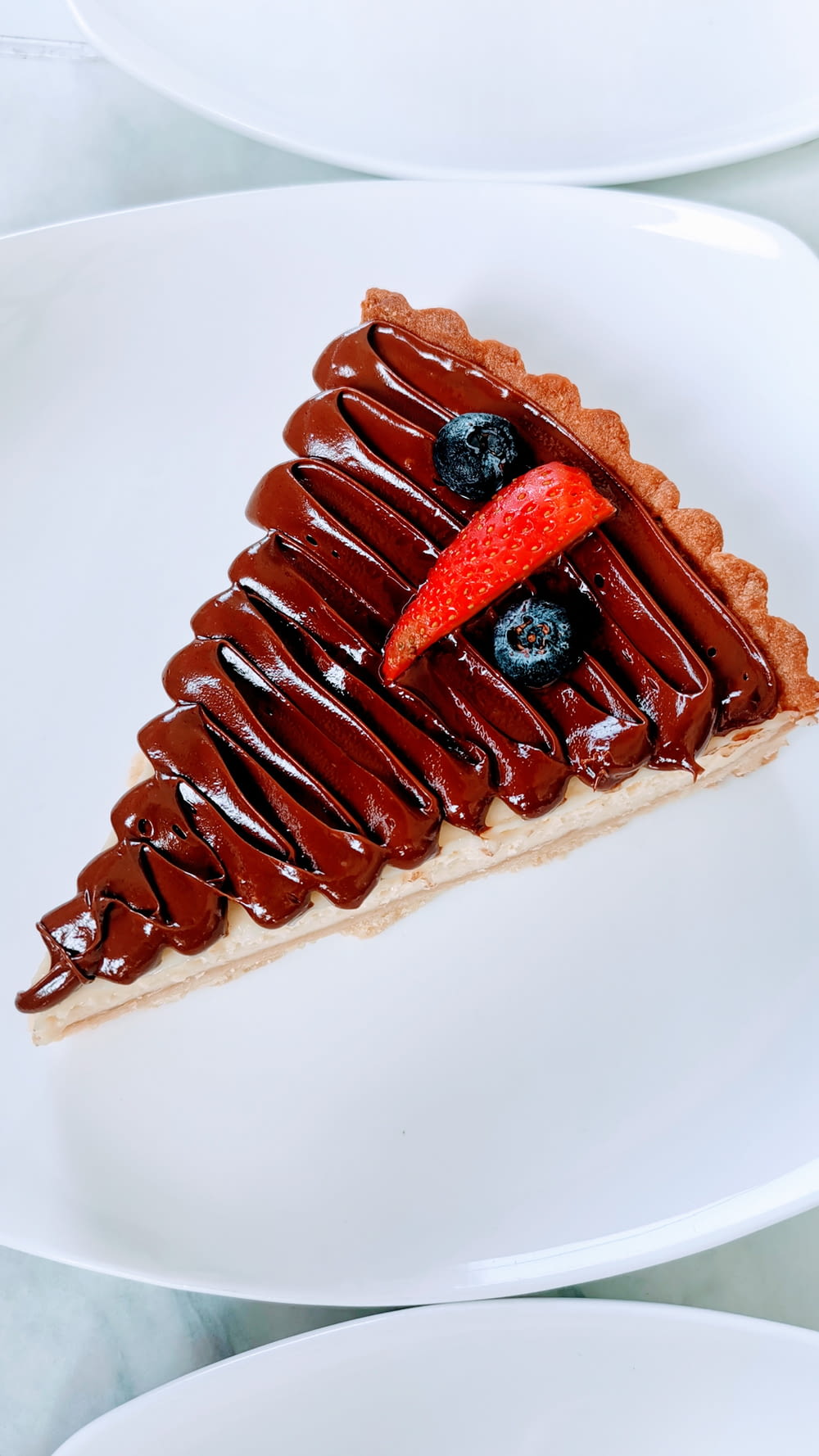 a slice of chocolate pie with a strawberry on top