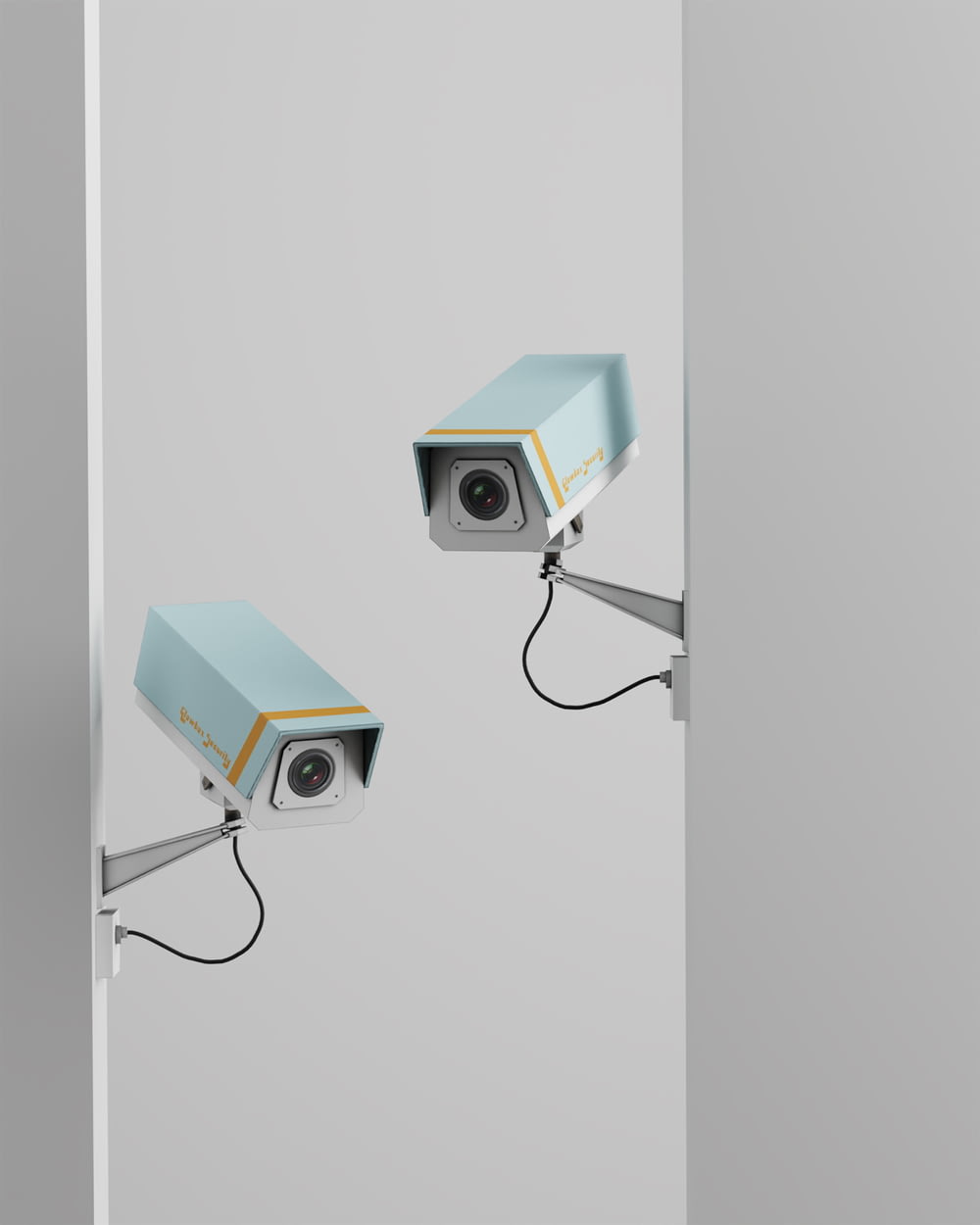 a pair of security cameras mounted on a wall