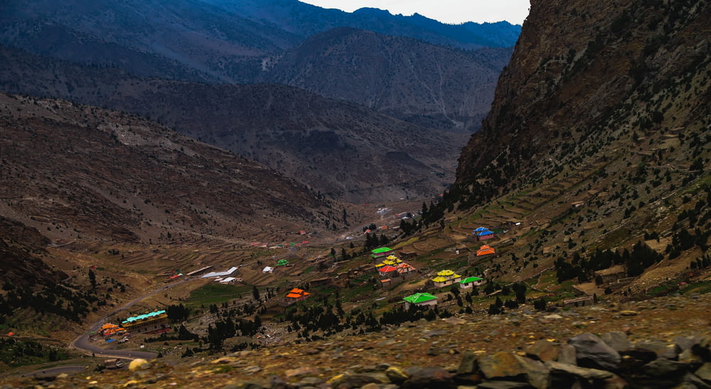a group of tents set up in the mountains