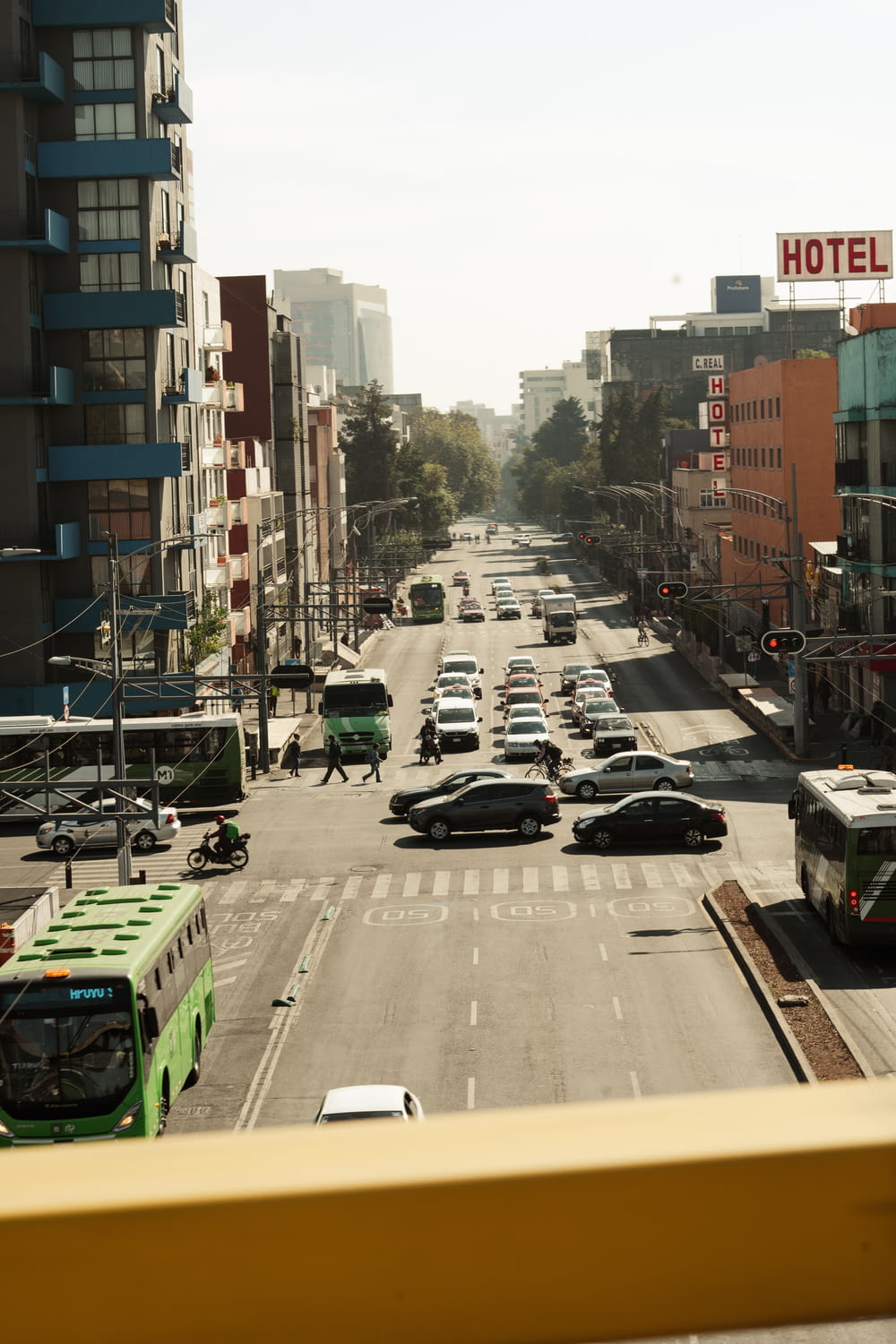 a city street with cars and buses on it