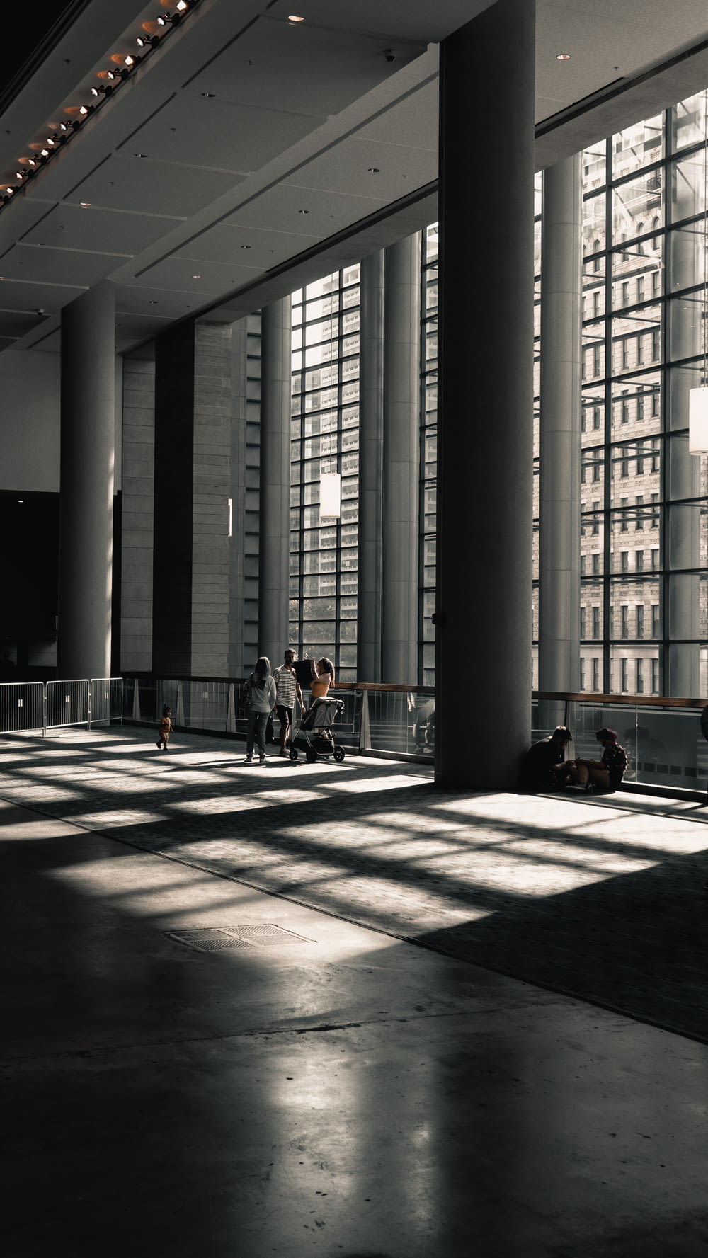 a couple of people sitting on a bench in a building