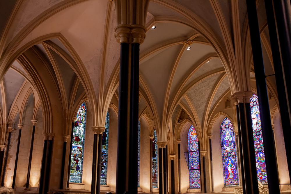a cathedral with stained glass windows and columns