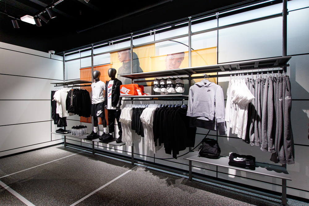 a display case with a variety of clothing on display