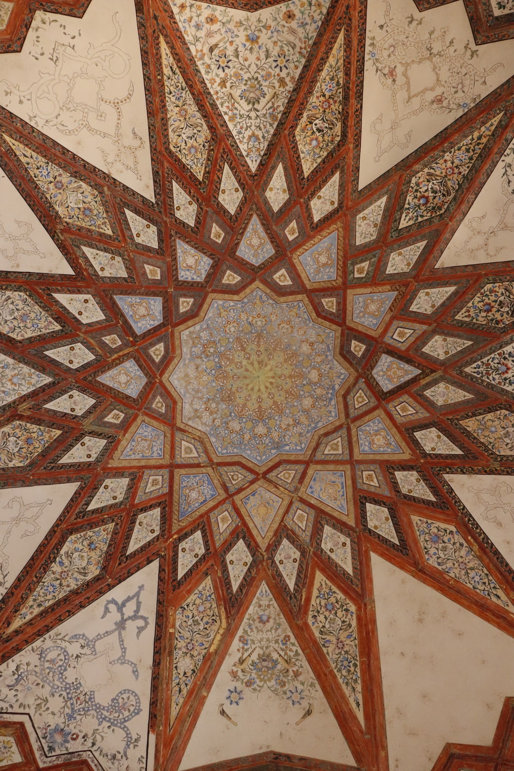the ceiling of a building with intricate designs