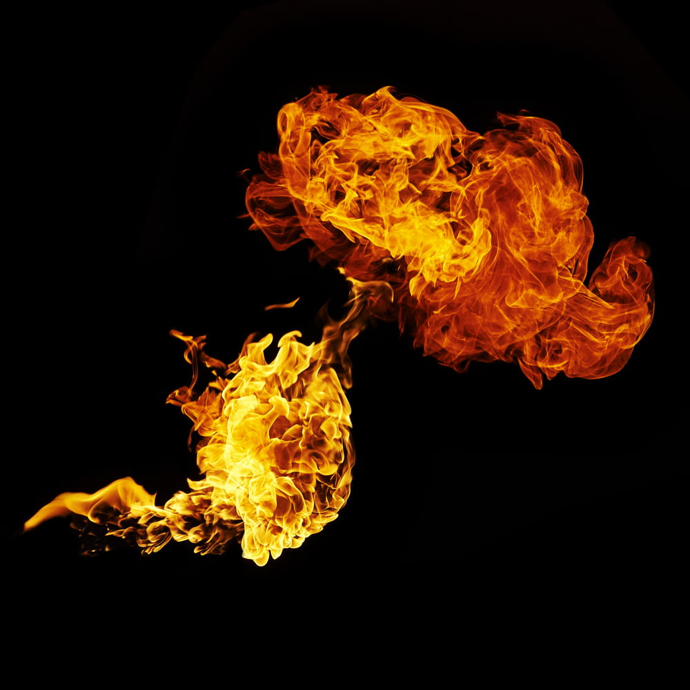 two fire flames on a black background