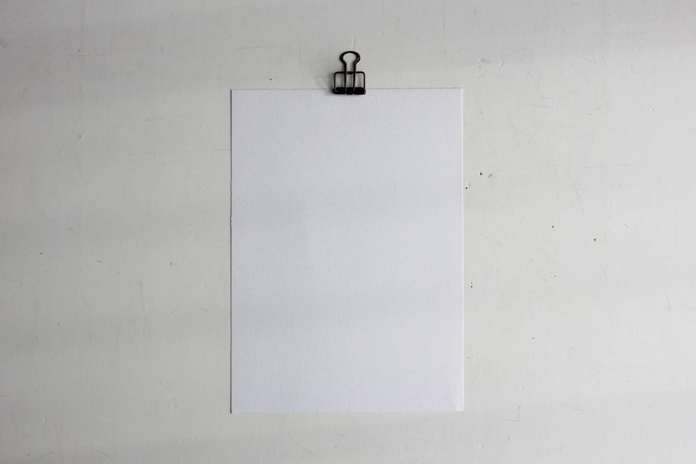 a white piece of paper hanging on a wall
