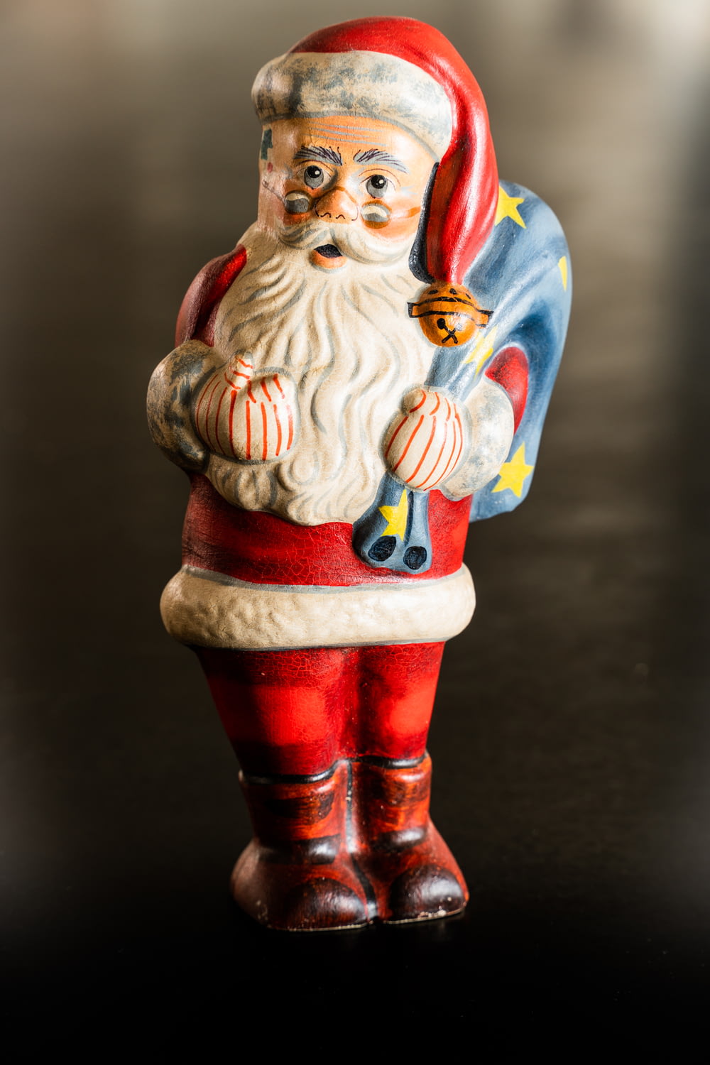 a santa clause figurine is standing on a table