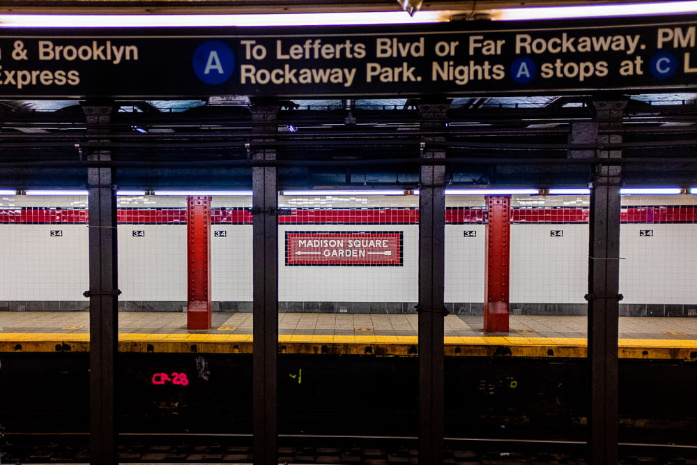 a subway station with a sign that says rockaway park nights stops at l a