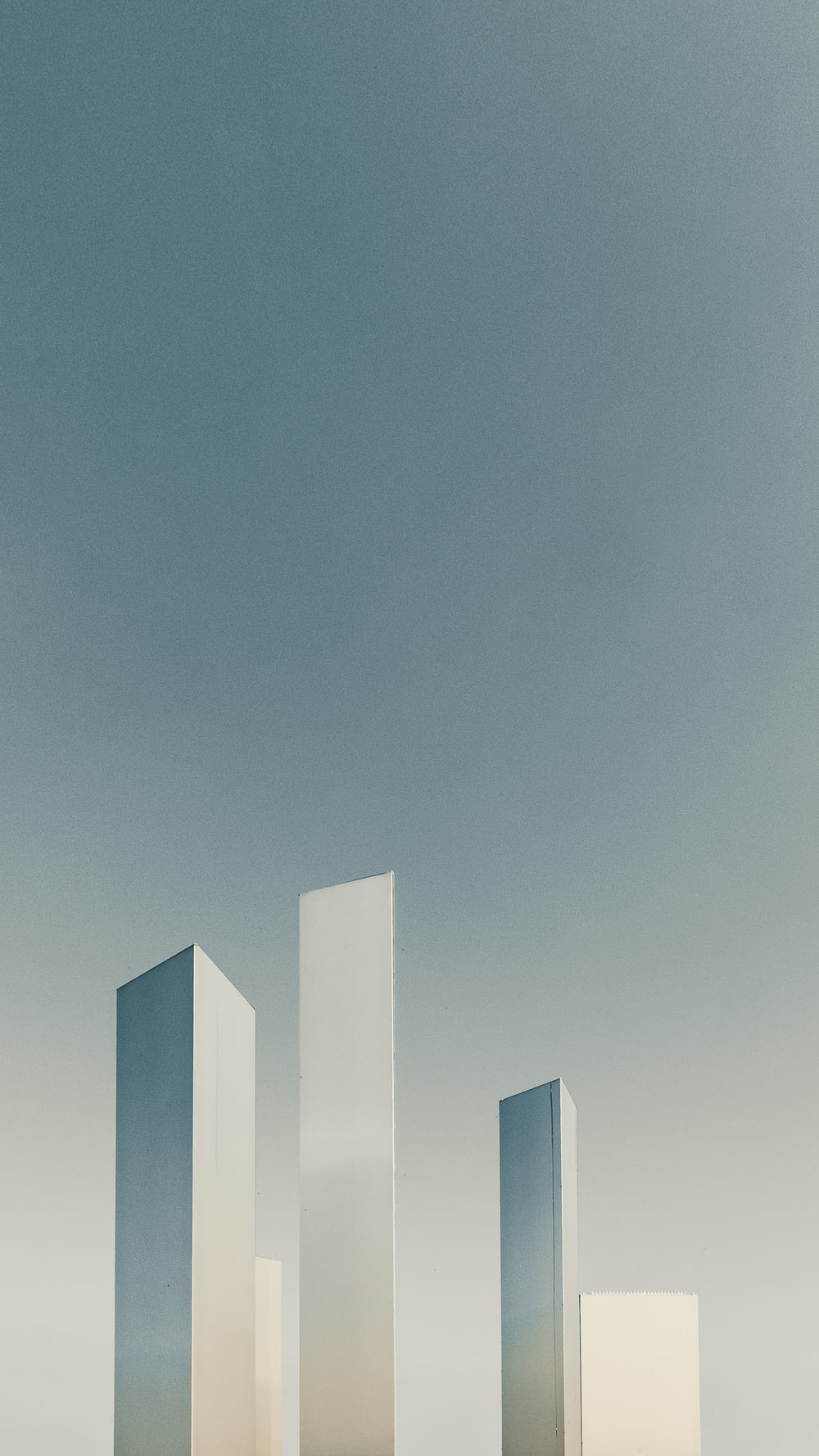 a group of tall white buildings sitting next to each other