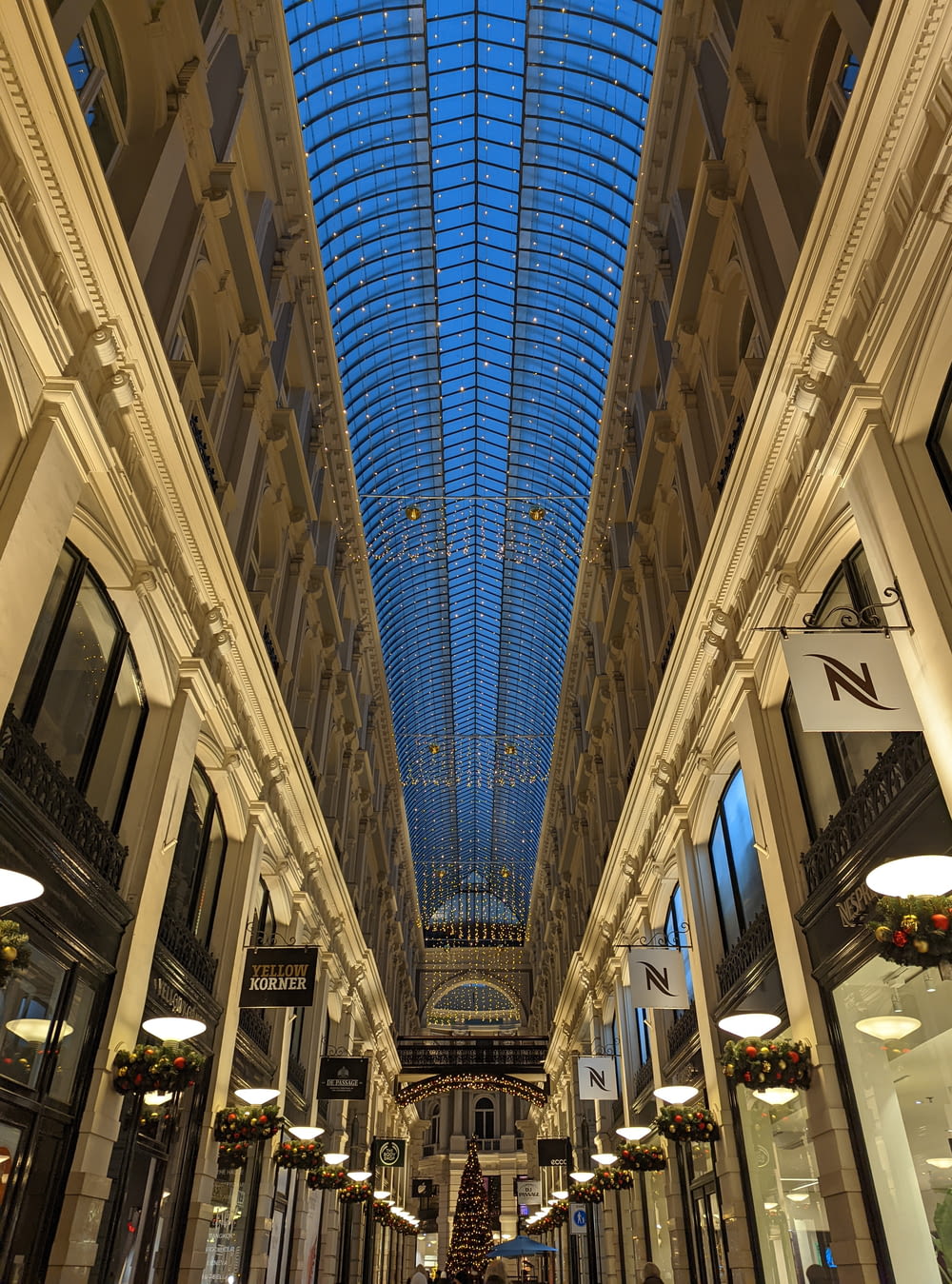 a view of a shopping mall with a skylight overhead