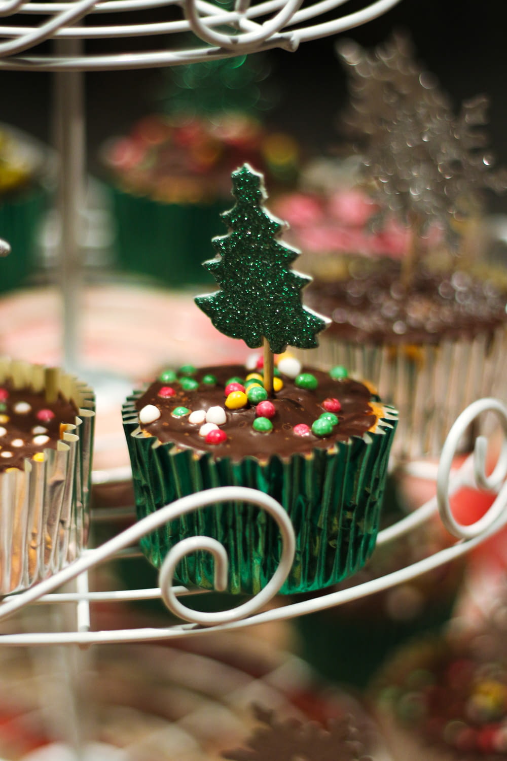 a close up of a cupcake with a christmas tree on top