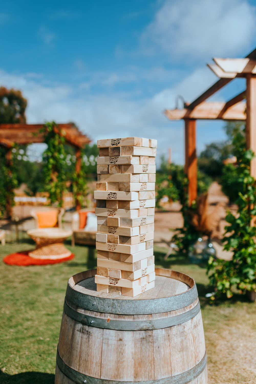 a stack of blocks sitting on top of a wooden barrel