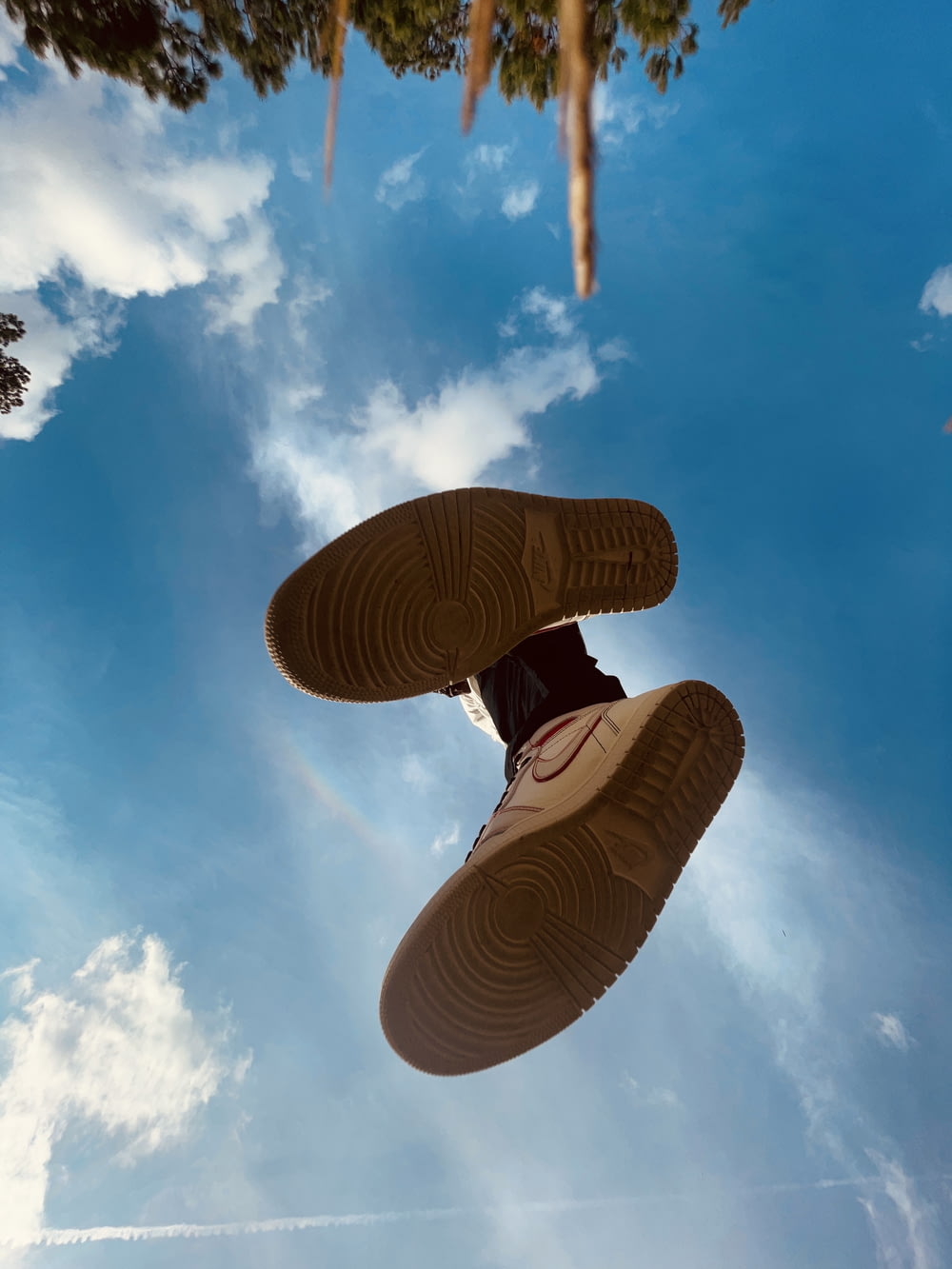 a pair of shoes that are in the air