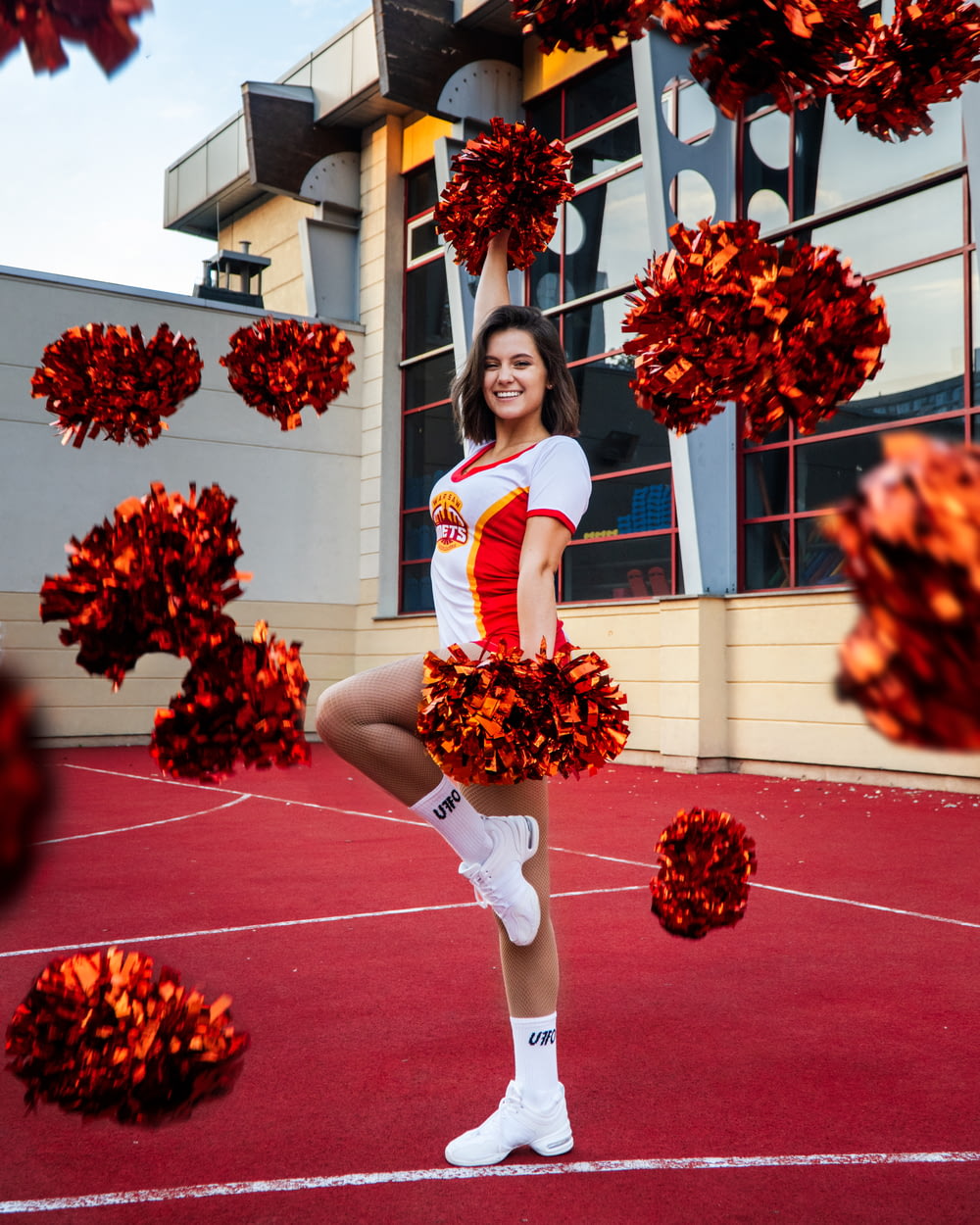 a woman in a cheerleader outfit posing for a picture