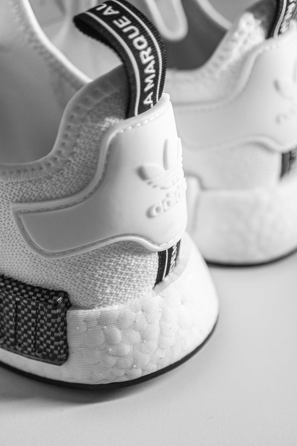 a close up of a white and black sneaker